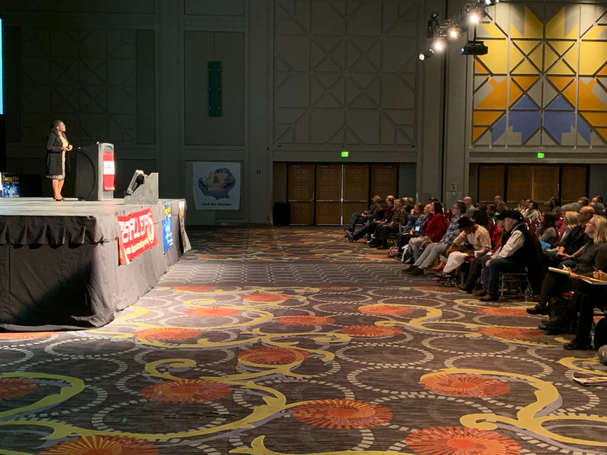 Dr. Jackson on stage at a conference